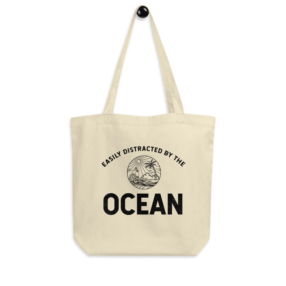 Easy Distracted By The Ocean Eco Tote Bag – Beach Canvas Tote Bag, Surfing Tote Bag, Ocean Reusable Bag, Surfing Lover Bag, Beach Lover Gift