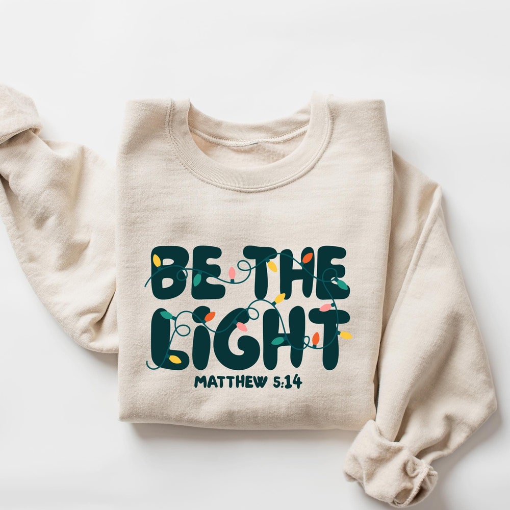 Be The Light Sweatshirt, Religious Christmas Sweatshirt, Christian Holiday Sweater, Faith Based Gift, Christmas Gifted, Festive Apparel Designed By Lightmyshirt